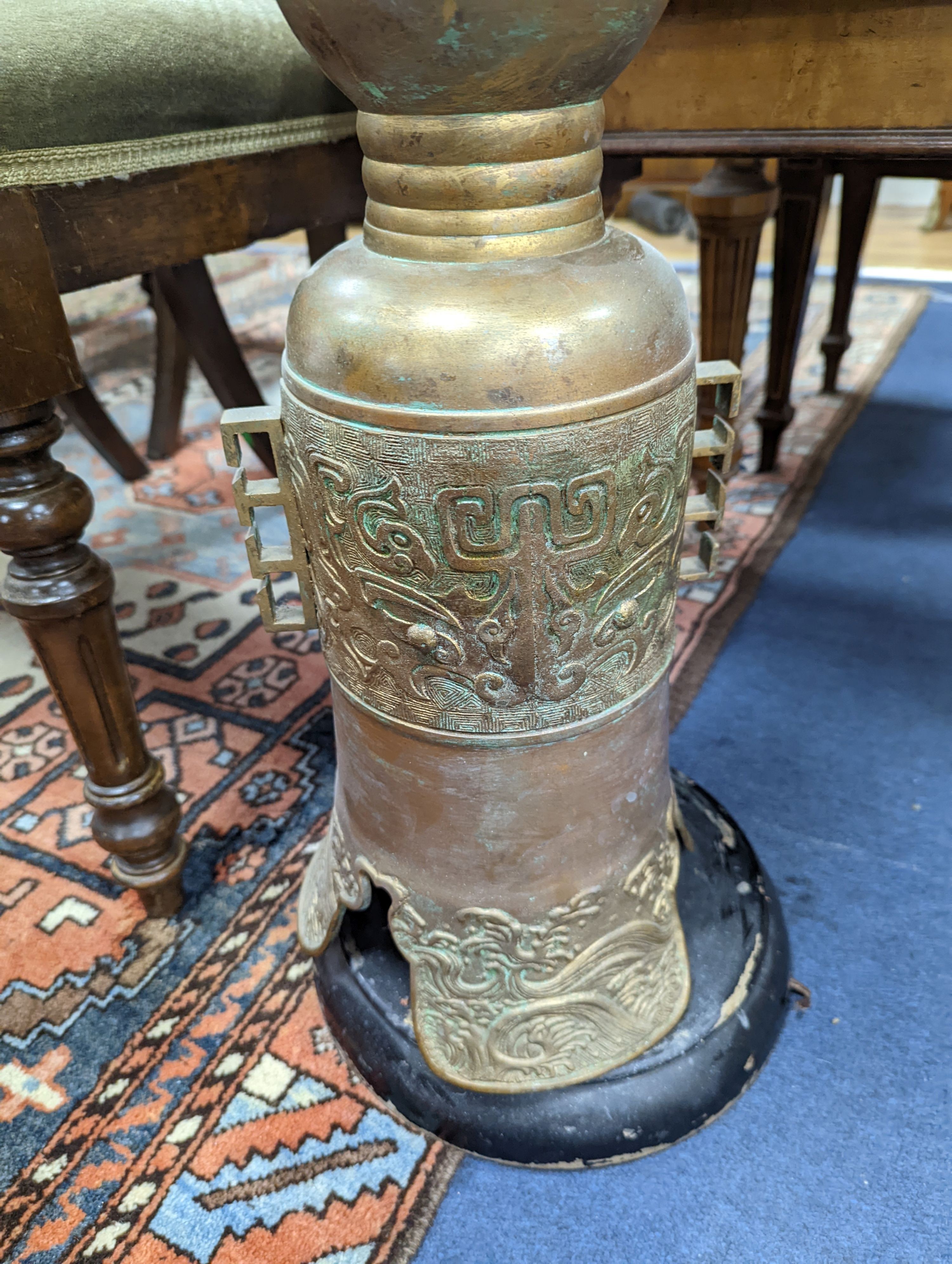 A bronze floor lamp